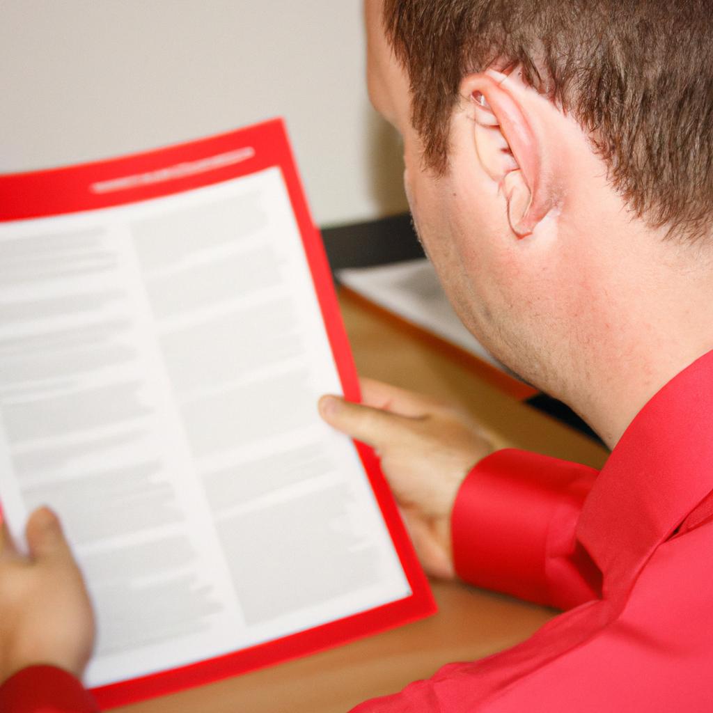 Person reviewing legal documents attentively